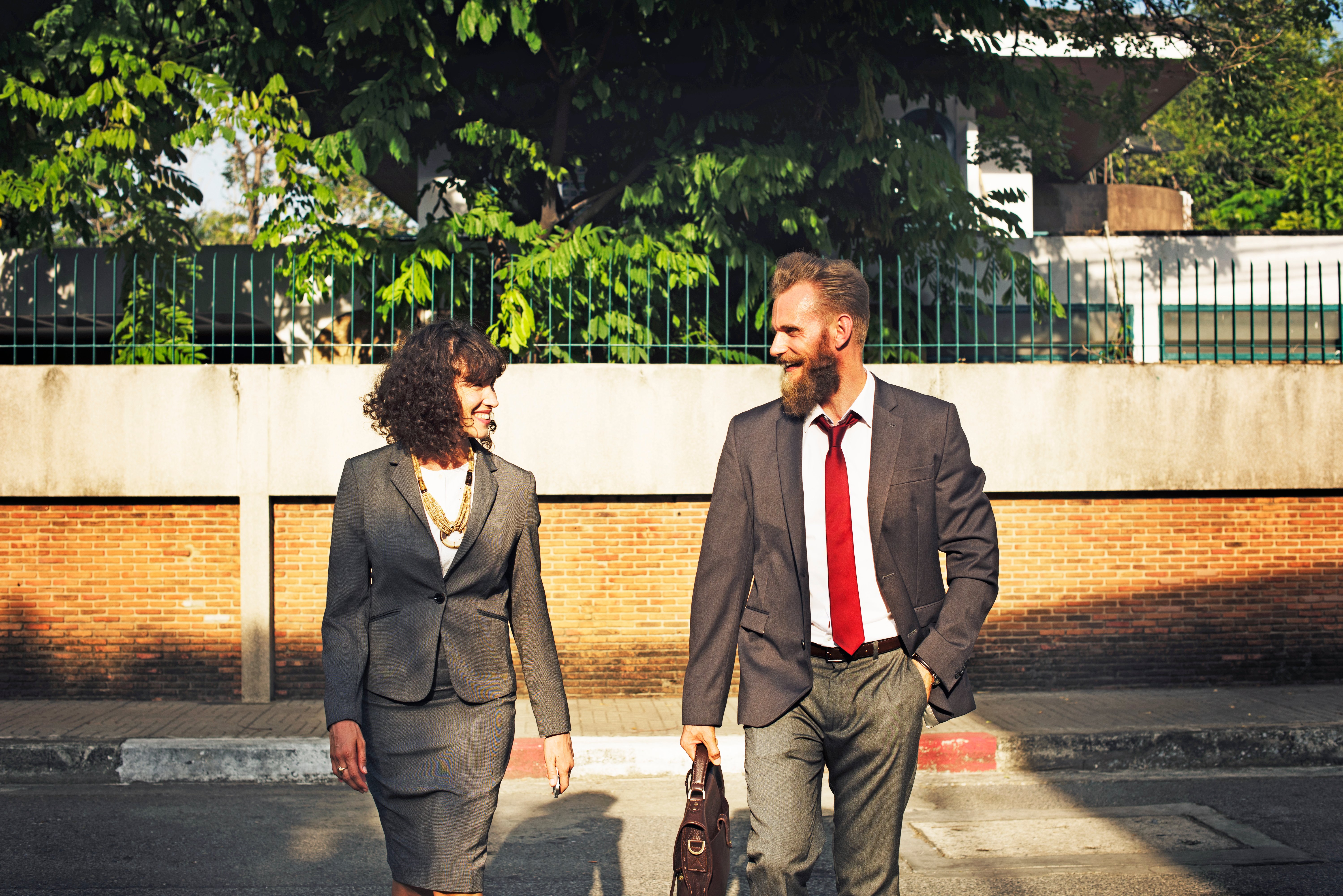 Woman and man in suits talking