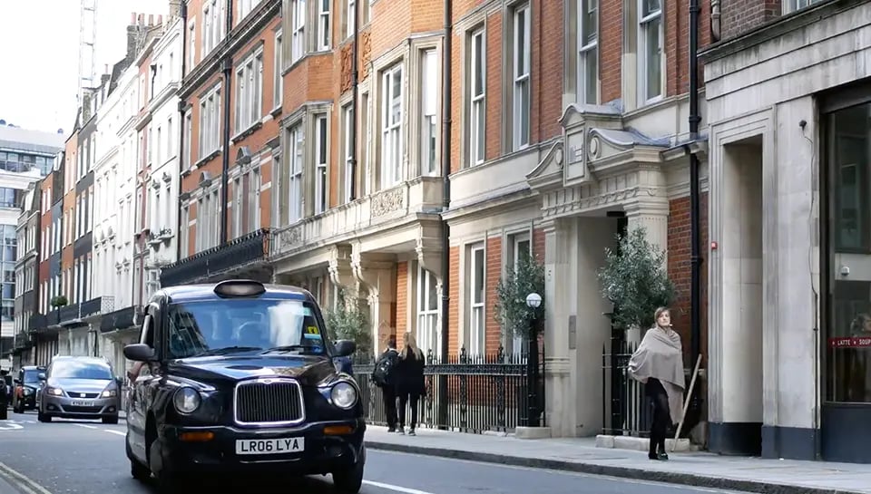 London street with black taxi